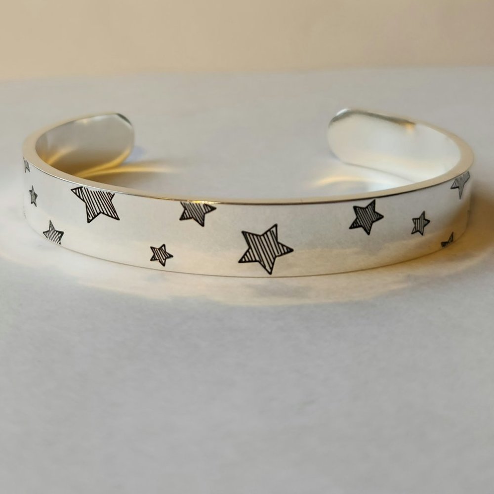 Friendship bracelet, stainless steel with stars and inscription inside.